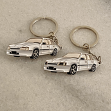 Alpine White Holden VK Brock Commodore metal keychain close up view

