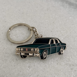Green Ford Falcon XT GT metal keychain close up view
