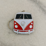 Large red retro travel camper van metal keychain close up view