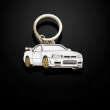 White Nissan Skyline GT-R R34 enamel metal keyring close up view